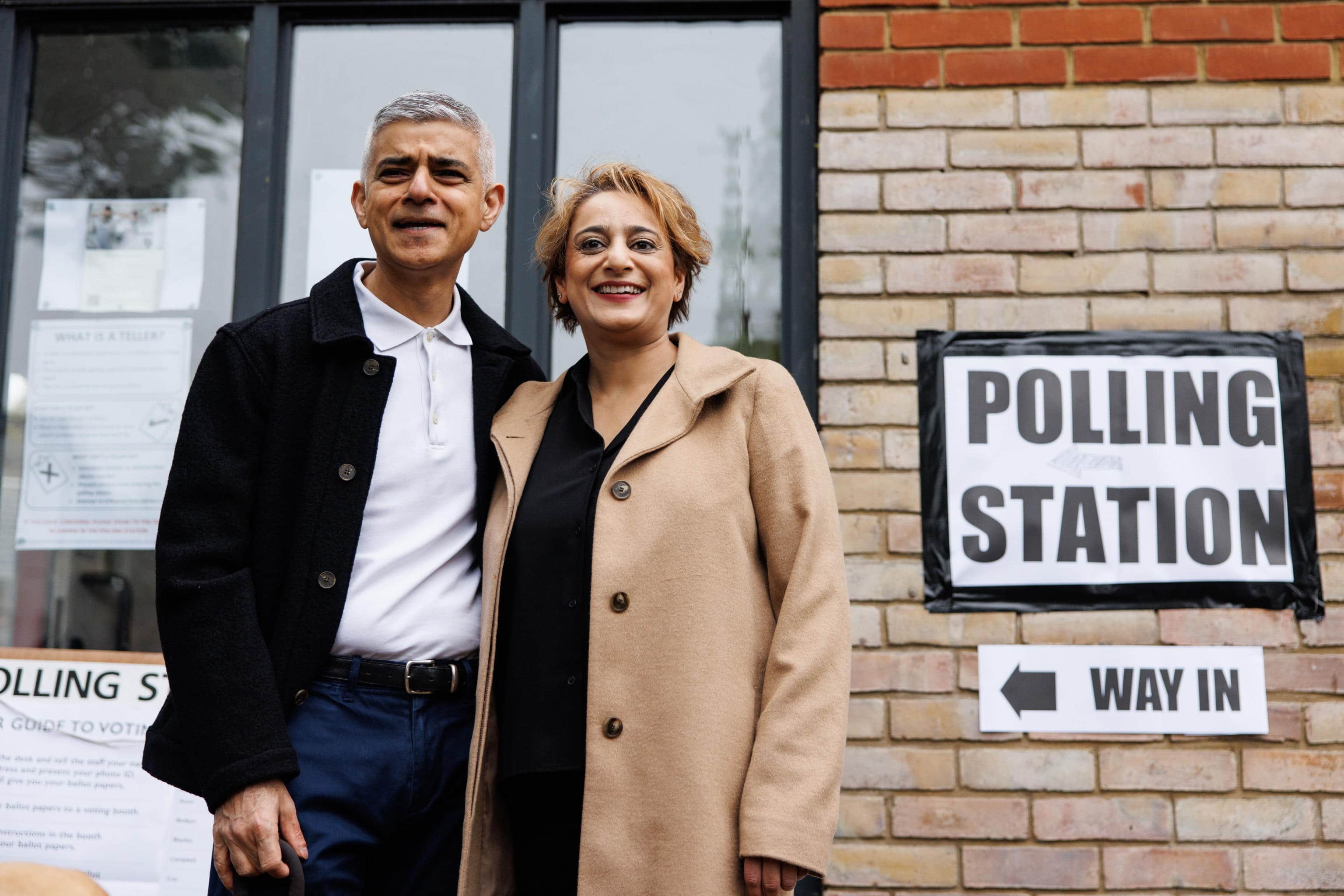epa11313863 Mayor of London Sadiq Khan (L) and his wife Saadiya Khan (R) pose for the media as they arrive at a polling station to vote in local elections in London, Britain, 02 May 2024. Local, regional, and police commissioner elections take place across England and Wales on 02 May 2024.  EPA/TOLGA AKMEN