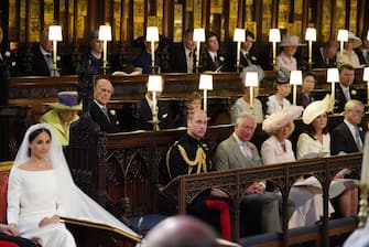 Meghan Markle in St George's Chapel, Windsor Castle for her wedding to Prince Harry watched by (middle row from left) Queen Elizabeth II, Duke of Edinburgh, Earl of Wessex, Viscount Severn, Countess of Wessex, Lady Louise Mountbatten-Windsor, Princess Royal, Sir Tim Laurence, (front row from left) Duke of Cambridge, Prince of Wales, Duchess of Cornwall Duchess of Cambridge, Duke of York.  . PRESS ASSOCIATION Photo. Picture date: Saturday May 19, 2018. See PA story ROYAL Wedding. Photo credit should read: Jonathan Brady/PA Wire