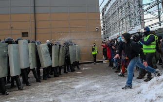 ST PETERSBURG, RUSSIA - JANUARY 31, 2021: Demonstrators throw snowballs at a police cordon during an unauthorised protest in support of the detained opposition activist Alexei Navalny. Navalny, who had been handed a suspended sentence in the Yves Rocher case in 2014, was detained at Sheremetyevo Airport near Moscow on 17 January 2021 for violating probation conditions. A court ruled that Navalny be put into custody until 15 February 2021. Peter Kovalev/TASS/Sipa USA