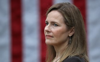 WASHINGTON, DC - SEPTEMBER 26: Seventh U.S. Circuit Court Judge Amy Coney Barrett looks on while being introduced by U.S. President Donald Trump as his nominee to the Supreme Court during an event in the Rose Garden at the White House September 26, 2020 in Washington, DC. With 38 days until the election, Trump tapped Barrett to be his third Supreme Court nominee in just four years and to replace the late Associate Justice Ruth Bader Ginsburg, who will be buried at Arlington National Cemetery on Tuesday. (Photo by Chip Somodevilla/Getty Images)