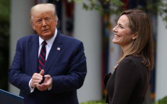 WASHINGTON, DC - SEPTEMBER 26: U.S. President Donald Trump (L) introduces 7th U.S. Circuit Court Judge Amy Coney Barrett as his nominee to the Supreme Court in the Rose Garden at the White House September 26, 2020 in Washington, DC. With 38 days until the election, Trump tapped Barrett to be his third Supreme Court nominee in just four years and to replace the late Associate Justice Ruth Bader Ginsburg, who will be buried at Arlington National Cemetery on Tuesday. (Photo by Chip Somodevilla/Getty Images)