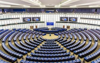General view of the hemicycle of the European Parliament in Brussels, Belgium, with the flag of the European Union above the desk of the president.