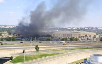 394262 01: Smoke comes out from the west wing of the Pentagon building September 11, 2001 in Arlington, Va., after a plane crashed into the building and set off a huge explosion. (Photo by Alex Wong/Getty Images)