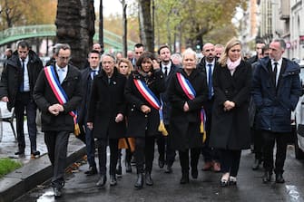 epa10972886 (L-R), Mayor of Paris' 11th arrondissement Francois Vauglin, French Prime Minister Elisabeth Borne, mayor of Paris Anne Hidalgo, mayor of Paris' 10th arrondissement Alexandra Cordebard and President of the French National Assembly Yael Braun-Pivet walk along the Saint-Martin canal to mark the eighth anniversary of the Paris attacks of 13 November 2015, in Paris, France, 13 November 2023. On 13 November 2015, gunmen killed 130 people in a terrorist attack across Parisian cafes, the Stade de France stadium and the Eagles of Death Metal concert at the Bataclan concert hall.  EPA/BERTRAND GUAY / POOL  MAXPPP OUT