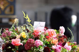 LONDON, ENGLAND - SEPTEMBER 19: Flowers are seen on the coffin of Queen Elizabeth II as it is carried in a procession after a service at Westminster Abbey on September 19, 2022 in London, England.  Elizabeth Alexandra Mary Windsor was born in Bruton Street, Mayfair, London on 21 April 1926. She married Prince Philip in 1947 and ascended the throne of the United Kingdom and Commonwealth on 6 February 1952 after the death of her Father, King George VI. Queen Elizabeth II died at Balmoral Castle in Scotland on September 8, 2022, and is succeeded by her eldest son, King Charles III. (Photo by Hannah McKay - WPA Pool/Getty Images)