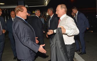 Russian President Vladimir Putin (R) meets Silvio Berlusconi at Fiumicino Airport in Rome, 10 June 2015. ANSA / TELENEWS