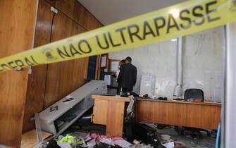epa10396830 Two men review a destroyed office inside the Planalto Palace after Bolsonaro protesters took over the Plaza de los Tres Poderes (Square of the Three Powers) to invade government buildings, in Brasilia, Brazil, 09 January 2023. Hundreds of supporters of former Brazilian President Jair Bolsonaro on 08 January invaded the headquarters of the National Congress, and also Supreme Court and the Planalto Palace, seat of the Presidency of the Republic, in a demonstration calling for a military intervention to overthrow President Luiz Inacio Lula da Silva. The crowd broke through the cordons of security forces and forced their way to the roof of the buildings of the Chamber of Deputies and the Senate, and some entered inside the legislative headquarters. So far, authorities detained some people involved in the violent acts which were widely condemned by all Brazilian institutions and by the international community.  EPA/ANDRE COELHO