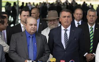 epa10225033 The president of Brazil and candidate for re-election, Jair Bolsonaro (R), and the governor-elect of Brasilia, Ibaneis Rocha (L), participate in a press conference, in the Palacio da Alvorada, in Brasilia, Brazil, 05 October 2022. Bolsonaro will face Former Brazilian President Luiz Inacio Lula da Silva (PT) in the second round of the presidential elections on 30 October. Together, Lula and Bolsonaro received 108 million votes (91.6%). According to the Superior Electoral Court (TSE), in the first round, Lula obtained 57 million votes (48.4%) and Bolsonaro, 51 million votes (43.2%).  EPA/Joedson Alves