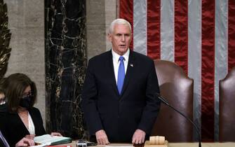Vice President Mike Pence readS the final certification of Electoral College votes cast in November's presidential election during a joint session of Congress after working through the night, at the Capitol in Washington, Thursday, Jan. 7, 2021. Violent protesters loyal to President Donald Trump stormed the Capitol Wednesday, disrupting the process. (AP Photo/J. Scott Applewhite, Pool)
