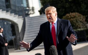 1230547827 WASHINGTON, DC - JANUARY 12: U.S. President Donald Trump speaks to reporters on the South Lawn of the White House before boarding Marine One on January 12, 2021 in Washington, DC. Following last week's deadly pro-Trump riot at the U.S. Capitol, President Trump is making his first public appearance with a trip to the town of Alamo, Texas to view the partial construction of the wall along the U.S.-Mexico border. (Photo by Drew Angerer/Getty Images)