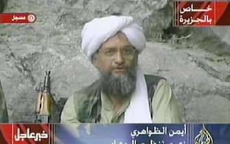 AFGHANISTAN:Ayman al-Zawahri, the head of a wing of the Egyptian Jihad, and alleged intellectual power behind terror mastermind Osama bin Laden is seen in this video footage recorded "very recently" at an undisclowsed lovation in Afghanistan aired by the Qatar-based satellite TV station al-Jazeera 07 October 2001. Retaliatory strikes against Afghanistan began 07 October with US and British forces bombing terrorist camps, air bases and air defense installations in the first stage of its campaign against the Taliban regime for sheltering bin Laden, who is the "prime suspect" in the 11 September attacks in the US. Al-Jaeera reported that the video was shot to be broadcast after the first US bombings.     AFP PHOTO/AL-JAZEERA (Photo credit should read AFP via Getty Images)