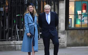 epa08281503 British Prime Minister, Boris Johnson waves as he leaves with his girlfriend Carrie Symonds the annual Commonwealth Service at Westminster Abbey in London, Britain, 09 March 2020. The service is an event where members of Britain's Royal family celebrate the Commonwealth - a global network of 54 countries. The event is the Sussex's final official royal engagement since announcing their intention of giving up Royal duties.  EPA/FACUNDO ARRIZABALAGA