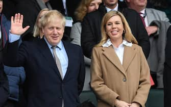 epa08276908 British Prime Minister, Boris Johnson and his partner Carrie Symonds ahead of the Six Nations rugby match between England and Wales held at Twickenham stadium in London, Britain, 07 March 2020.  EPA/FACUNDO ARRIZABALAGA