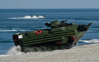 epa10094836 Taiwan's AAV7 amphibious assault vehicle surfaces from the sea during an Amphibious landing drill as part of the Han Kuang military exercise in Pingtung, Taiwan, 28 July 2022. The drill is part of the Taiwan's annual Han Kuang military exercise that simulates response to enemies attack on major targets in Taiwan.  EPA/RITCHIE B. TONGO