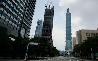 epa10090991 An empty street in Xinyi business district during the Wanan air defense drill in Taipei, Taiwan, 25 July 2022. The drill aims to raise public awareness of emergency warnings to reduce the possibility of casualties and damage if such attacks do take place amidst the growing military tension between China and Taiwan. During the drill road traffic and pedestrian movement are suspended.  EPA/RITCHIE B. TONGO