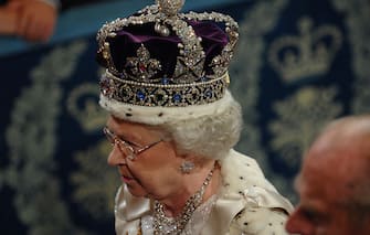 Queen Elizabeth II wears the Imperial State Crown of diamonds and jewels at the House of Lords for the State Opening of Parliament (Photo by Â © Pool Photograph / Corbis / Corbis via Getty Images)