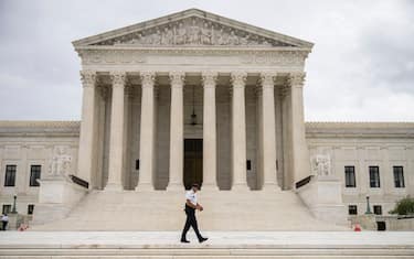 WASHINGTON, DC - SEPTEMBER 01: A Supreme Court Police officer patrols at the U.S. Supreme Court on September 1, 2021 in Washington, DC. A new Texas law that prohibits most abortions after six weeks of pregnancy went into effect on Wednesday. The U.S. Supreme Court did not act on a request to block the law. (Photo by Drew Angerer/Getty Images)