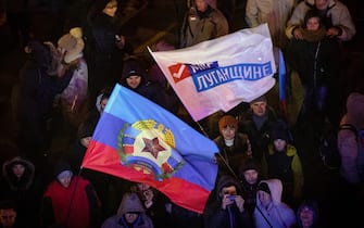 LUGANSK REGION, UKRAINE - NOVEMBER 11, 2018: People wave flags during a concert in Teatralnaya Square marking the elections of the head of the Lugansk People's Republic (LPR) and the members of the LPR People's Council. Stanislav Krasilnikov/TASS (Photo by Stanislav Krasilnikov\TASS via Getty Images)