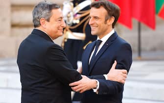 France's President Emmanuel Macron greets Italy's Prime Minister Mario Draghi (L) at the Palace of Versailles, near Paris, on March 10, 2022, prior to the EU leaders summit to discuss the fallout of Russia's invasion in Ukraine. - EU leaders are scrambling to find ways to urgently address the fallout of Russia's invasion of Ukraine that has imperilled the bloc's economy and exposed a dire need for a stronger defence. (Photo by Ludovic MARIN / AFP) (Photo by LUDOVIC MARIN/AFP via Getty Images)