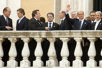 ROME, ITALY - OCTOBER 29:  (L-R) European leaders  Jacques Chirac, Tony Blair, Gerhard Schroeder, Romano Prodi, Simeon Saxe-Coburg, Silvio Berlusconi and Rodriquez Zapatero stand on the Capitole Terrace prior to attending the ceremony for the signing of the Treaty to establish a Constitution for Europe on October 29, 2004, in Rome, Italy.  (Photo by Franco Origlia/Getty Images)