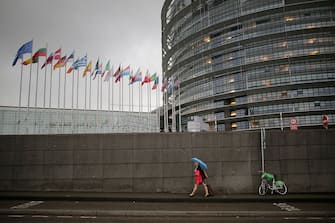 STRASBOURG, FRANCE - MAY 12:  People make their way into the European Parliament during a rain storm on May 12, 2016 in Strasbourg, France.  The United Kingdom  will hold a referendum on June 23, 2016 to decide whether or not to remain a member of the European Union (EU), an economic and political partnership involving 28 European countries, which allows members to trade together in a single market and provide free movement across it's borders for cirtizens.  (Photo by Christopher Furlong/Getty Images)