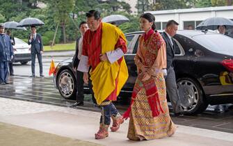 epa07939684 King Jigme Khesar Namgyel Wangchuck and Queen Jetsun Pema of Bhutan arrive at the Imperial Palace to attend the enthronement ceremony of Japan's Emperor Naruhito, in Tokyo, Japan, 22 October 2019. Some 2,000 guests from Japan and dignitaries from over 180 countries are expected to attend the enthronement ceremony.  EPA/CARL COURT / POOL