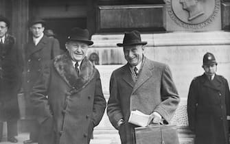 Konrad Adenauer (1876 - 1967, left), the German Chancellor, and Robert Schuman (1886 - 1963, right), the French Foreign Minister, leave the Foreign Office in London after attending the European Army Conference, 18th February 1952.  (Photo by Ron Burton/Keystone/Hulton Archive/Getty Images)