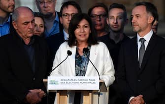 epa08515012 The incumbent mayor of Paris, Anne Hidalgo (C) delivers a speech after winning the second round of the French Municipal elections in Paris, France, 28 June 2020. The second round of municipal elections was to be held on 22 March 2020 but was delayed due to the spread of the coronavirus pandemic causing the Covid-19 disease.  EPA/JULIEN DE ROSA