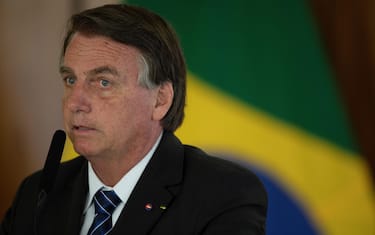 epa09532688 President Brazil Jair Bolsonaro with his Colombian counterpart Ivan Duque (out of frame), during a meeting at the Palacio do Planalto, in the city of Brasilia, Brazil, 19 October 2021. Brazilian President Jair Bolsonaro, together with his Colombian counterpart, Ivan Duque, expressed his concern about the actions of dissident groups of the former FARC on the Amazon border between the two countries.  EPA/Joedson Alves