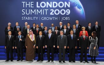 G20 leaders (First Row from L to R) South Korean President Lee Myung-Bak, French President Nicolas Sarkozy, Saudi Foreign Minister Saud al-Faisal, Chinese President Hu Jintao, British Prime Minister Gordon Brown, Brazilian President Luiz Inacio Lula da Silva, Indonesian President Susilo Bambang Yudhoyono, Mexican President Felipe Calderon and Argentine President Cristina Fernandez de Kirchner, (Second Row  from L to R) President of the European Commission José Manuel Barroso, Indian Prime Minister Manmohan Singh, Turkish Prime Minister Recep Tayyip Erdogan, US President Barack Obama, Russian President Dmitry Medvedev, South African President Kgalema Motlanthe, Dutch Prime Minister Jan Peter Balkenende, Spanish Prime Minister Jose Luis Rodriguez Zapatero and German Chancellor Angela Merkel, (Third Row from L to R) International Monetary Fund (IMF) Managing Director Dominique Strauss-Kahn,  UN Secretary General  Ban Ki-moon, World Trade Organisation (WTO) Director General  Pascal Lamy, Thai Prime Minister and chair of the Association of Southeast Asian Nations (ASEAN) Abhisit Vejjajiva, Italian Prime Minister Silvio Berlusconi, New Partnership for Africa's Development (NEPAD)  Meles Zenawi, Australian Prime Minister Kevin Rudd, Japanese Prime Minister Taro Aso, Czech Prime Minister and President of the European Council Mirek Topolanek, Governor of the Bank of Italy Mario Draghi and World Bank President Robert Zoellick pose for a family photo during the G20 summit at the ExCel centre, in east London, on April 2, 2009. World leaders meet Thursday for a crunch summit of the Group of 20 richest nations aimed at fixing the crisis-wracked global economy. AFP PHOTO/Eric Feferberg (Photo credit should read ERIC FEFERBERG/AFP via Getty Images)