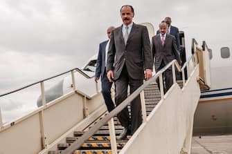 Eritrea's President Isaias Afwerki steps down from the aircraft at the airport in Gondar, for a visit in Ethiopia, on November 9, 2018. (Photo by EDUARDO SOTERAS / AFP)        (Photo credit should read EDUARDO SOTERAS/AFP via Getty Images)