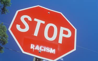 Stop sign with "racism" added (Photo by: Joe Sohm/Visions of America/Universal Images Group via Getty Images)
