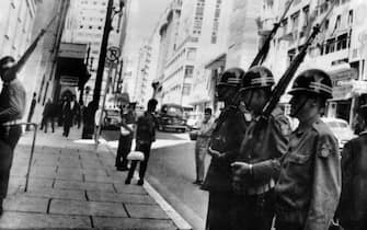 Brazilian soldiers patrol the streets of Sao Paulo on April 03, 1964 after the military putsch that led to the overthrow of President Joao Goulart by members of the Brazilian Armed Forces, and a military regime led by Humberto Castelo Branco. (Photo by - / AFP)        (Photo credit should read -/AFP via Getty Images)