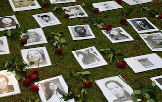 TOPSHOT - View of pictures of persons who were killed or went missing during the 1964-1985 dictatorship, during a demo on the 58th anniversary of the military coup at Ibirapuera Park, in Sao Paulo, Brazil, on March 31, 2022. (Photo by NELSON ALMEIDA / AFP) (Photo by NELSON ALMEIDA/AFP via Getty Images)