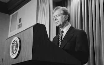 Photograph of President Jimmy Carter announcing new sanctions against Iran following the taking American hostages. Photographed by Marion S. Trikosko. Dated 1980. (Photo by: Photo12/Universal Images Group via Getty Images)