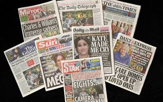 An arrangement of UK daily newspapers photographed as an illustration in Brighton on March 8, 2021, shows front page headlines reporting on the story of the interview given by Meghan, Duchess of Sussex, wife of Britain's Prince Harry, Duke of Sussex, to Oprah Winfrey, which aired on US broadcaster CBS. - Prince Harry and his wife Meghan's explosive tell-all interview with Oprah Winfrey went much further than expected and will be hugely damaging to the royal family, British media said Monday. The Duke and Duchess of Sussex, as they are formally known, delivered "enough bombshells to sink a flotilla", reported The Daily Telegraph, as the dust settled on the broadcast in the United States on Sunday night. (Photo by Glyn KIRK / AFP) (Photo by GLYN KIRK/AFP via Getty Images)