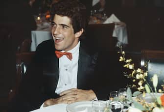 1984: A smiling John F Kennedy, Jr wears a red bow tie at a fundraising event.  (Photo by Mariette Pathy Allen/Getty Images)
