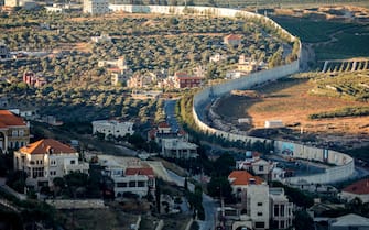 This picture taken on July 19, 2023 shows a view of the border wall with Lebanon near the northern Israeli kibbutz of Misgav Am. (Photo by JALAA MAREY / AFP) (Photo by JALAA MAREY/AFP via Getty Images)