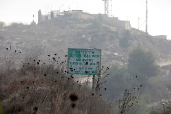 A picture taken on September 5, 2022, near the Israeli Kibbutz of Baram, close to the border with Lebanon, shows a sign reading "no entry closed military area" in Hebrew, English, and Arabic. (Photo by JALAA MAREY / AFP) (Photo by JALAA MAREY/AFP via Getty Images)