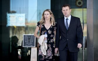 Kate McCann (L) and her husband Gerry McCann (R), parents of missing British youngster Madeleine McCann, leave the court house in Lisbon after delivering statements in their case against Portuguese police officer Goncalo Amaral on July 8, 2014. The McCanns, whose daughter Madeleine disappeared in Portugal in 2007, are suing Goncalo Amaral for libel and had flown from England to Lisbon to deliver personal impact statements at the Palace of Justice. Madeleine disappeared from a bedroom of her family's holiday apartment in the Algarve resort of Praia da Luz a few days short of her fourth birthday as her parents dined with friends at a nearby tapas restaurant.  AFP PHOTO / PATRICIA DE MELO MOREIRA        (Photo credit should read PATRICIA DE MELO MOREIRA/AFP via Getty Images)