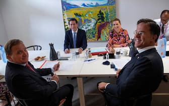 Dutch Prime Minister Mark Rutte (front, R) poses with Sweden's Prime Minister (L) Stefan Lofven (L) Austria's Chancellor Sebastian Kurz (2ndL) and Denmark's Prime Minister Mette Frederiksen (3rdR) ahead of a meeting on the sideline of an EU summit at the European Council building in Brussels, on July 18, 2020, as the leaders of the European Union hold their first face-to-face summit over a post-virus economic rescue plan. - The EU has been plunged into a historic economic crunch by the coronavirus crisis, and EU officials have drawn up plans for a huge stimulus package to lead their countries out of lockdown. (Photo by Francisco Seco / POOL / AFP) (Photo by FRANCISCO SECO/POOL/AFP via Getty Images)