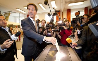 Dutch liberal party VVD leader Mark Rutte casts his vote in The Hague for the general elections on June 9, 2010. Polling stations opened across the Netherlands Wednesday for elections dominated by Europe's economic woes and led by the centre-right liberal party with its plans to slash public spending. AFP PHOTO / ANP / LEX VAN LIESHOUT netherlands out - belgium out (Photo credit should read LEX VAN LIESHOUT/AFP via Getty Images)