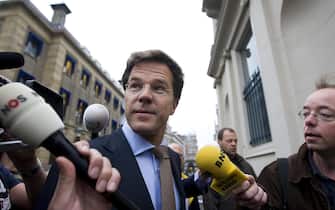Dutch Liberal leader Mark Rutte speaks to the press as he arrives at the Noordeinde royal palace in The Hague on June 11, 2010 before his first meeting with head of state Queen Beatrix on June 11, 2010.  Rutte, whose party secured a one-seat victory in June 9 elections, went to the palace  to discuss "complicated" coalition talks, the government information service said. AFP PHOTO / ANP / VALERIE KUYPERS  ***netherlands out - belgium out*** (Photo credit should read VALERIE KUYPERS/AFP via Getty Images)