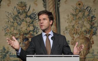 Dutch Prime Minister-elect Mark Rutte, leader of the rightist, pro-business VVD party set to lead the next government talks to the press in The Hague, The Netherlands, on October 8, 2010. Rutte will head a centre-right coalition with the Christian Democrat party, supported in parliament by the anti-Islam Freedom Party of Geert Wilders. AFP PHOTO:ANP PHIL NIJHUIS netherlands out - belgium out (Photo credit should read PHIL NIJHUIS/AFP via Getty Images)