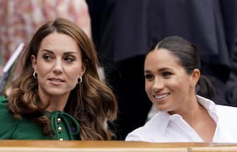 epa07714359 Catherine (L), the Duchess of Cambridge and Meghan Markle, the Duchess of Sussex in the Royal Box on Centre Court during the Wimbledon Championships at the All England Lawn Tennis Club, in London, Britain, 13 July 2019. EPA/NIC BOTHMA EDITORIAL USE ONLY/NO COMMERCIAL SALES