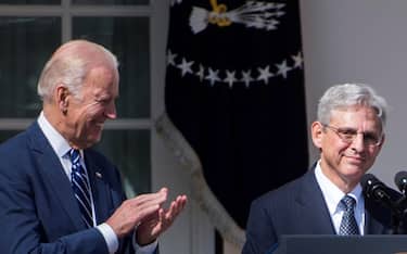 epa08922946 (FILE) - Then US Vice President Joe Biden (L), applauds the nominee to the United States Supreme Court, Chief Judge, US Court of Appeals, DC Circuit Merrick Garland (R), during a ceremony in the Rose Garden of the White House in Washington, DC, USA, 16 March 2016 (Reissued 06 January 2021). According to reports on 06 January, President-elect Joe Biden will nominate Merrick Garland to become the next US Attorney General.  EPA/SHAWN THEW