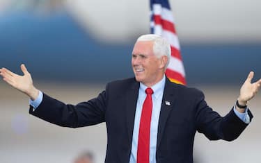 epa08763122 US Vice President Mike Pence gestures to the crowd during a campaign stop in Portsmouth, New Hampshire, USA, 21 October 2020. Vice President Pence and President Donald J. Trump face former Vice President Joe Biden and Senator Kamala Harris in the 03 November 2020 general election.  EPA/CJ GUNTHER