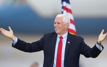 epa08763122 US Vice President Mike Pence gestures to the crowd during a campaign stop in Portsmouth, New Hampshire, USA, 21 October 2020. Vice President Pence and President Donald J. Trump face former Vice President Joe Biden and Senator Kamala Harris in the 03 November 2020 general election. EPA/CJ GUNTHER