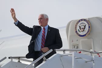 Vice President Mike Pence waves while getting off of Air Force Two at the 128th Air Refueling Wing near Milwaukee Mitchell International Airport in Milwaukee on Tuesday, Oct. 13, 2020. Pence was headed to a campaign event at Weldall Manufacturing in Waukesha.  Pence 0404 (Photo by Mike De Sisti / Milwaukee Journal Sentinel/USA Today Network/Sipa USA)