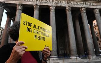 Demonstrators with signs stage a silent flashmob to demand the release of the researcher Patrick Zaki from jail in Egypt, Rome, Italy, 23 February 2020. ANSA/RICCARDO ANTIMIANI